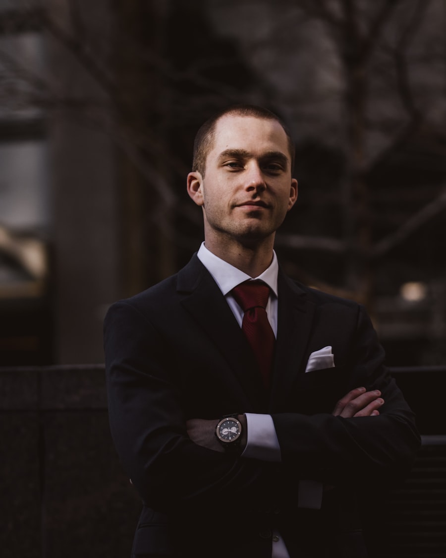 A funeral director in formal dark dress